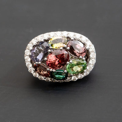 טבעת בעיצוב ייחודי משובצת 7 אבני חן טורמלין נטורל אובליות בצבעים שונים ויהלומים מסביב